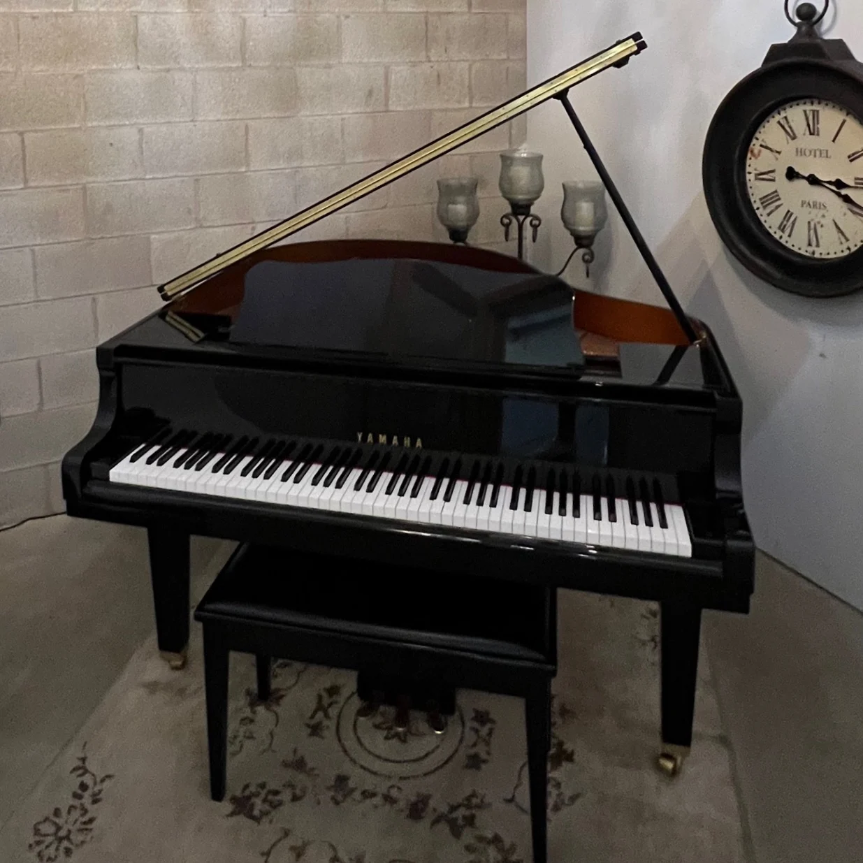 A grand piano in an Elite Studios teaching room