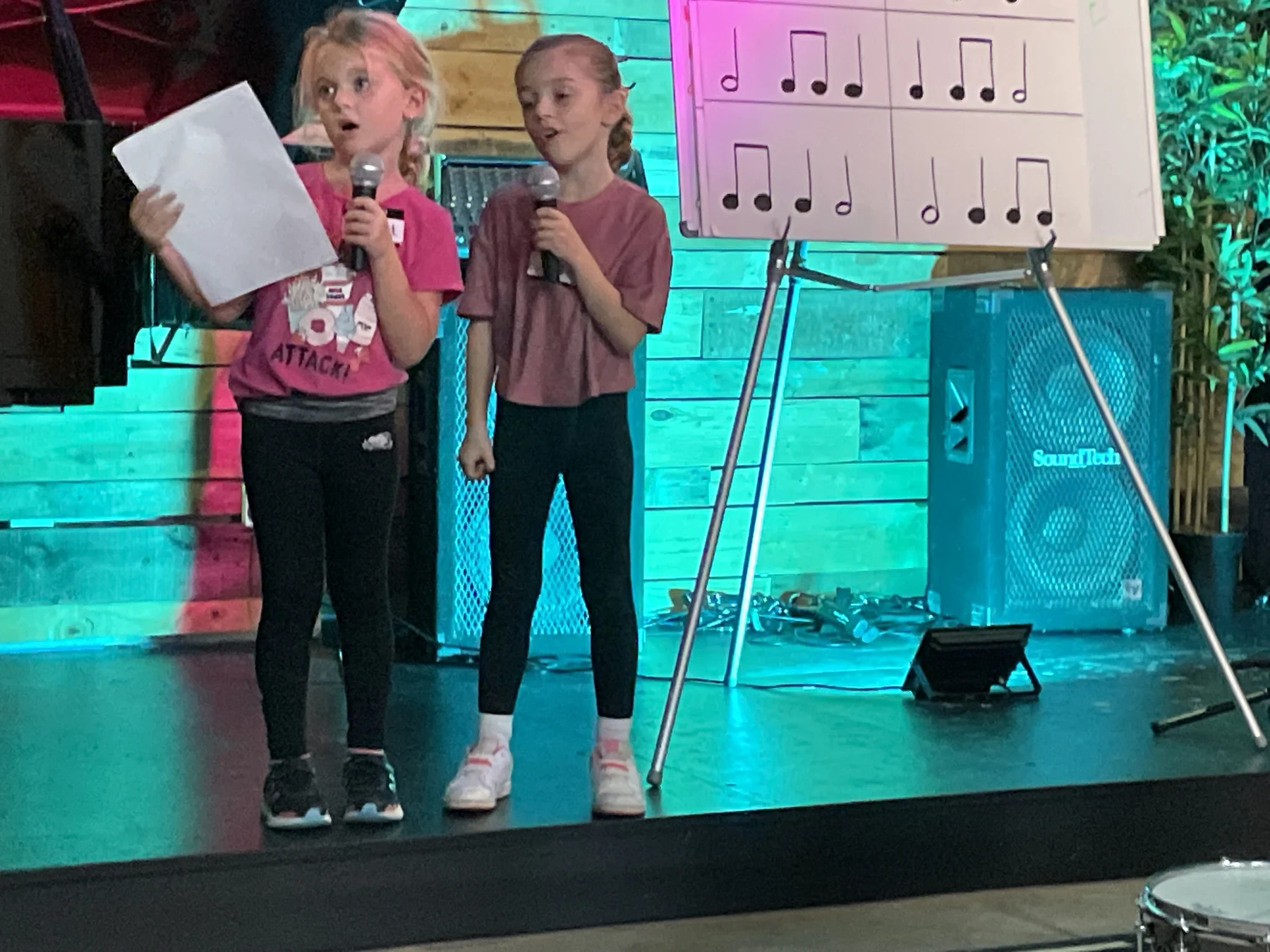 Two young singers performing together in the studio