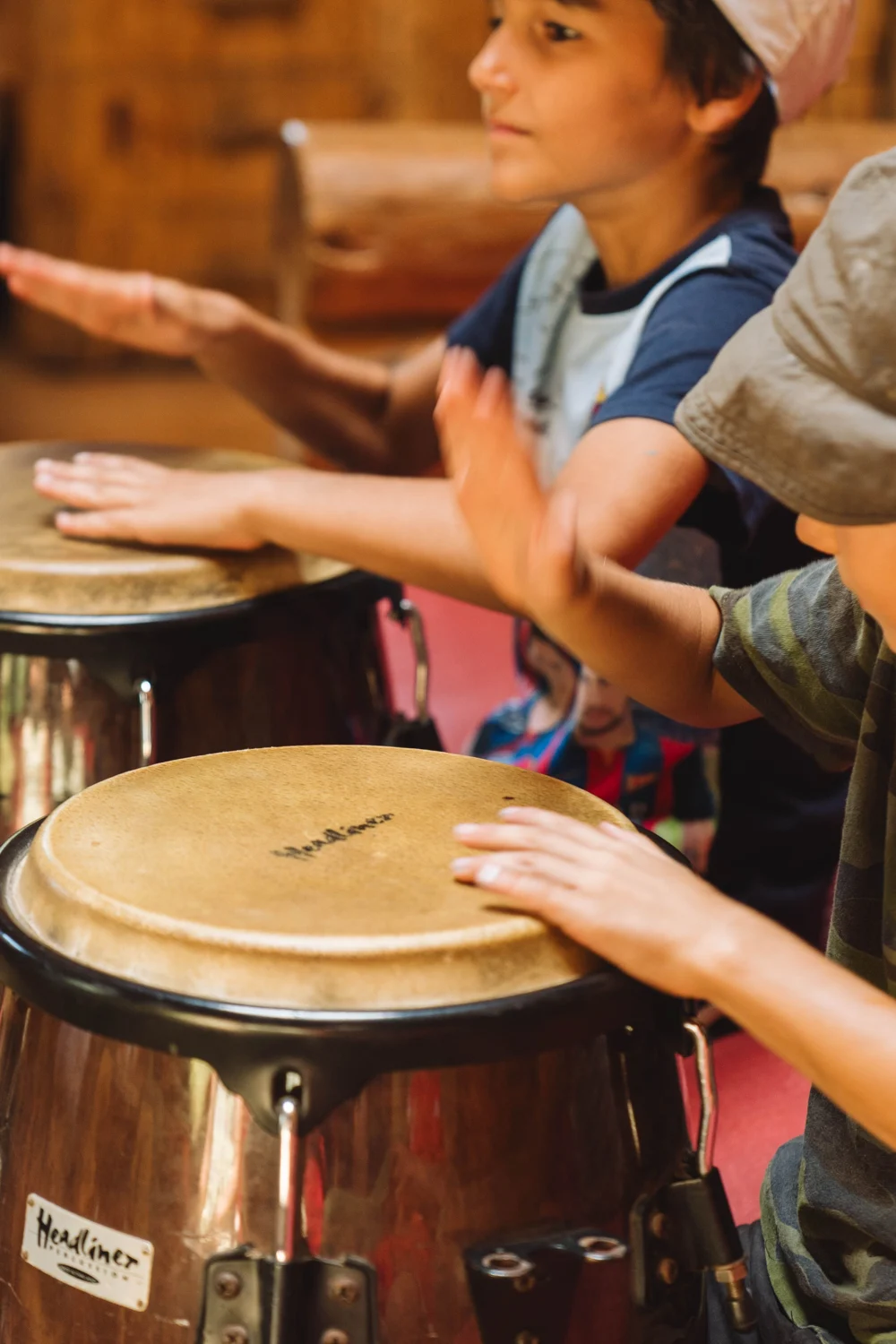 Children exploring rhythm on hand drums
