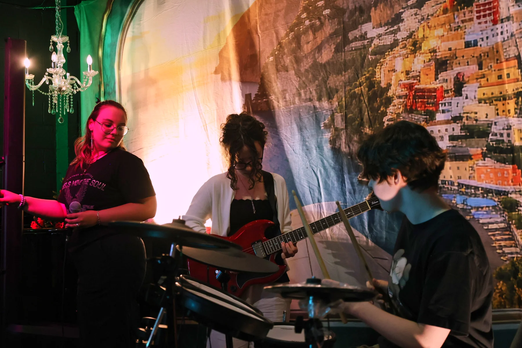 Elite Studios musicians performing together with vocals, guitar and drums